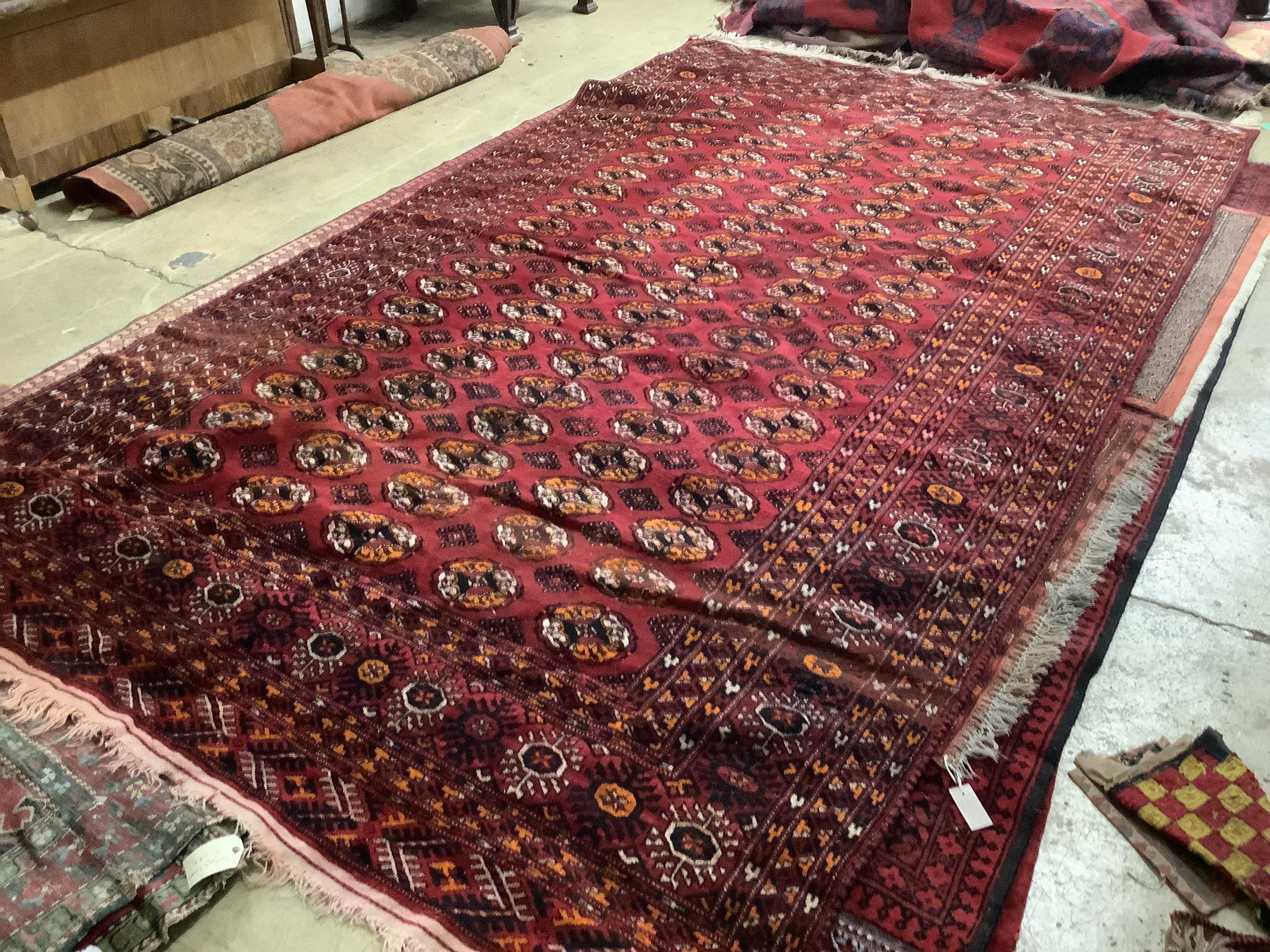 A Persian Bokhara design carpet, 403 x 225cm